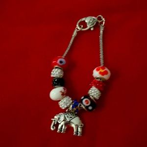 Charm bracelet with elephant charm.